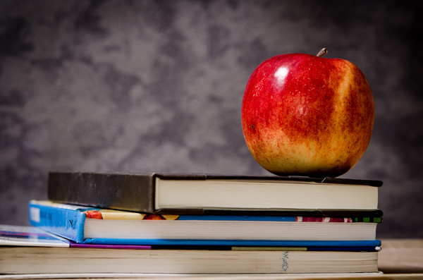 Apple on a pile of books